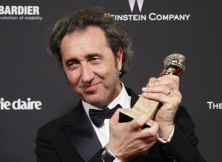 Italian producer Nicola Giuliano holds up his award for Best Foreign Language Film for "The Great Beauty" at The Weinstein Company & Netflix after party after the 71st annual Golden Globe Awards in Beverly Hills