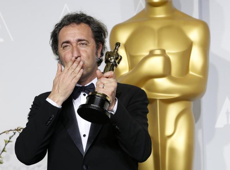 Paolo Sorrentino, director of Italian film "The Great Beauty" poses with his award for best foreign language film at the 86th Academy Awards in Hollywood