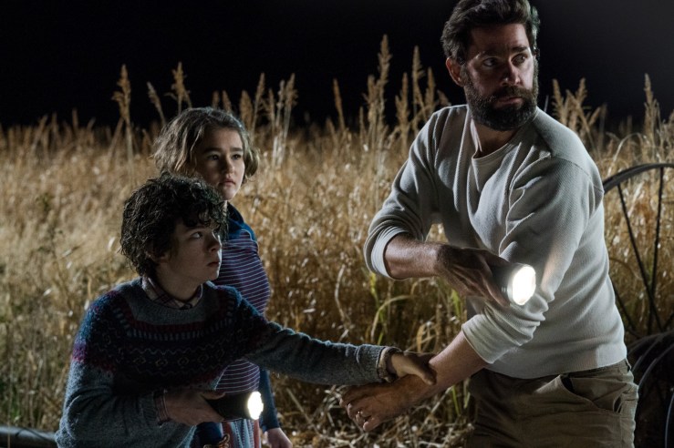 Left to right: Noah Jupe plays Marcus Abbott, Millicent Simmonds plays Regan Abbott and John Krasinski plays Lee Abbott in A QUIET PLACE, from Paramount Pictures.
